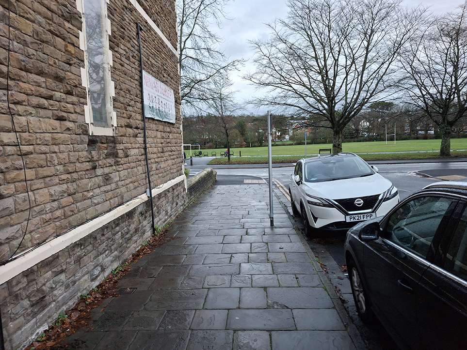 A photograph showing shared widened pennant stone footway on Pen-Y-Wain Place, near the zebra crossing at Ninan Road.