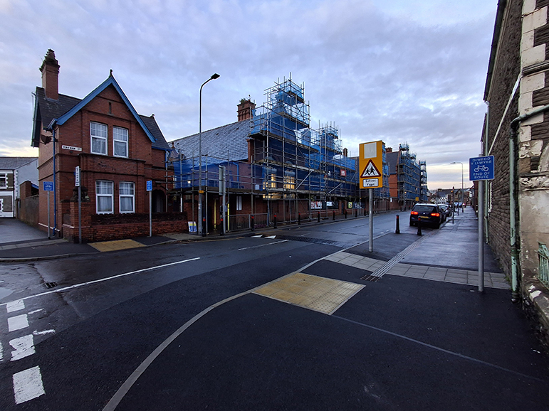 A photograph showing an uncontrolled crossing on Pen-Y-Wain Road in the background and the shared widened footway in the foreground.